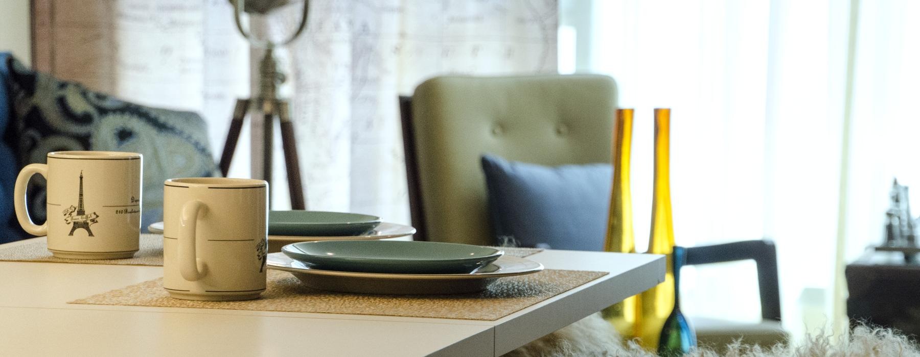 a table with plates and cups on it