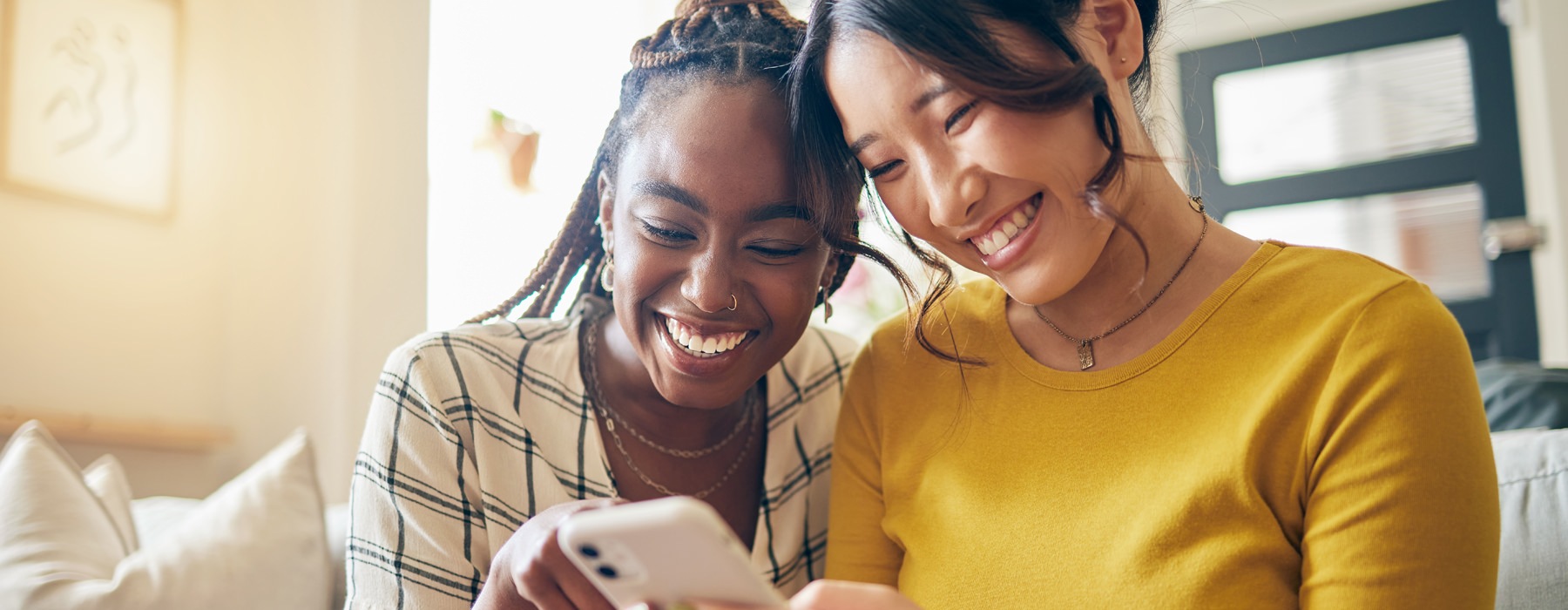 women looking at a phone