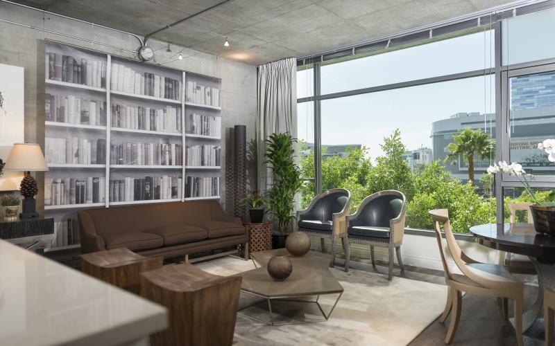 a room with a couch and chairs