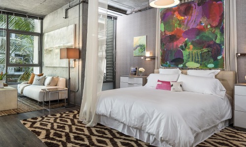 a bedroom with a large window