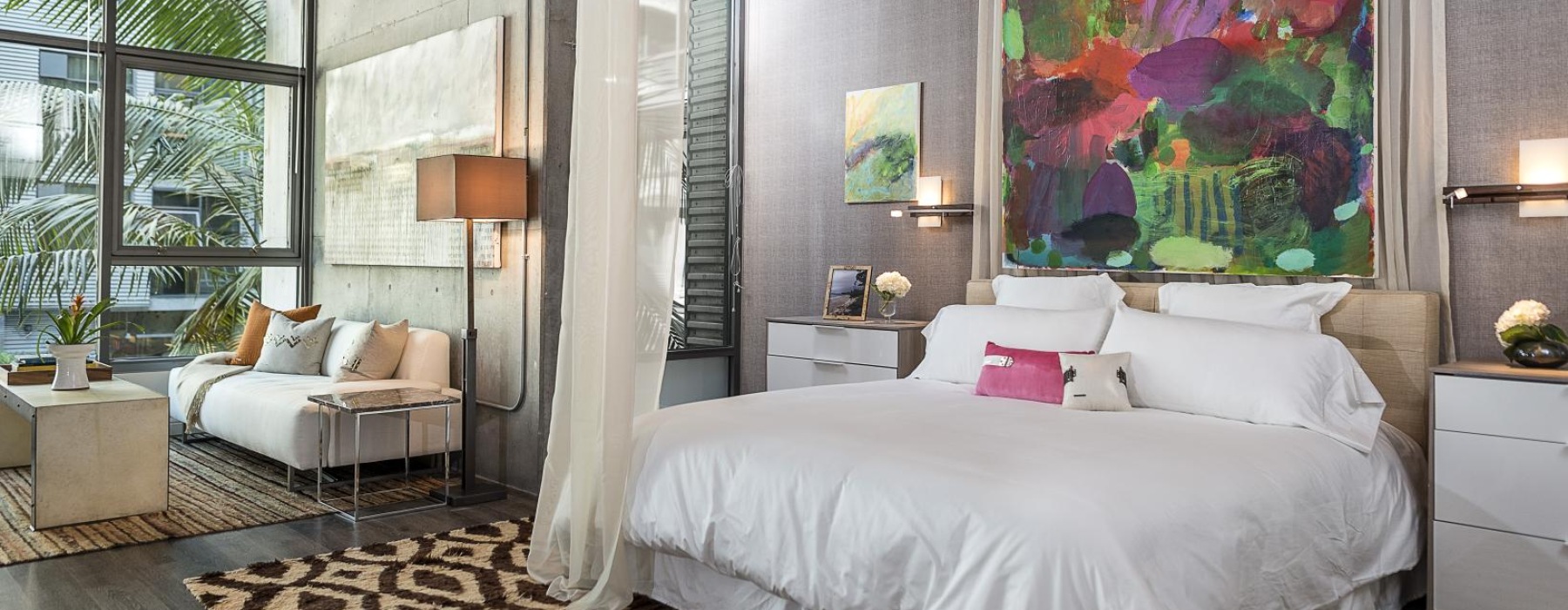 a bedroom with a large window