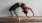 woman bending over backwards in an exercise studio
