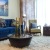 a living room with a blue couch and a coffee table